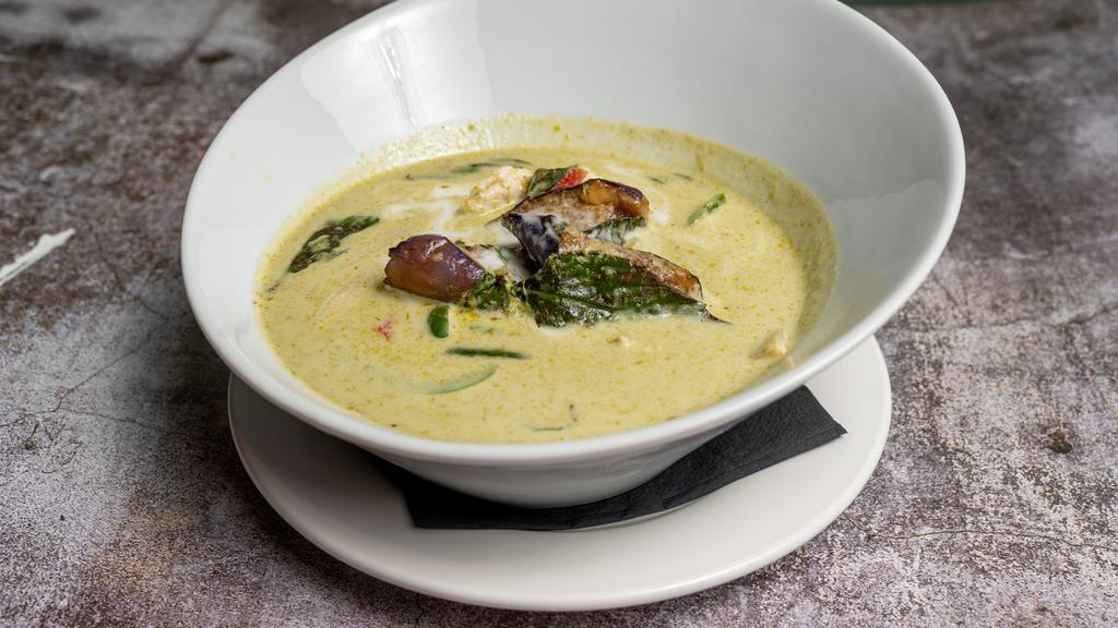 Green Curry · Coconut milk, bamboo, eggplant, sweet thai basil and bell pepper in green curry sauce.
