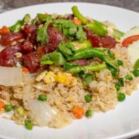 Chinese Sausage Fried Rice · Stir fried jasmine rice with Chinese sausage, egg, green and white onions, peas, carrots and...