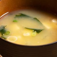 Miso Soup · Soybean booth with a studies seaweed, scallions and shiitake mushrooms.