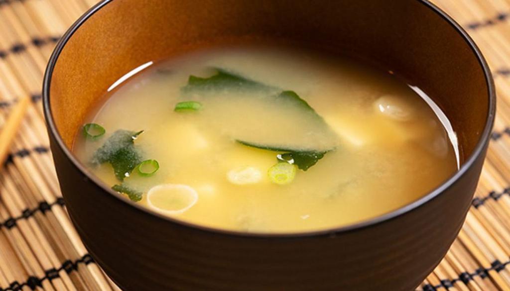 Miso Soup · Soybean booth with a studies seaweed, scallions and shiitake mushrooms.