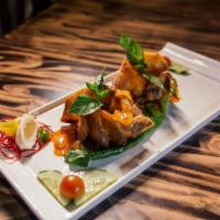 Thai Crispy Red Snapper · Red snapper file served with seasonal vegetables, Thai sweet chili sauce.