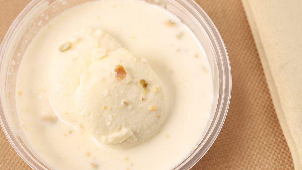 Rasmalai · Vegetarian. Two pieces. Cheese and milk. Consists of white cream, sugar, milk, and paneer. The dessert is also described as a rich cheese cake without a crust.
