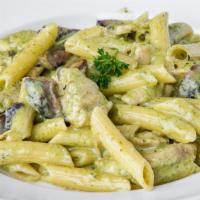 Pasta Andrea · Penne pasta with chicken and  portobello mushrooms in a pesto cream sauce and Parmesan cheese