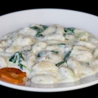 Gnocchi Andrea · Home made potato gnocchi with touch of  cinnamon and served with basil marinara or gorgonzol...