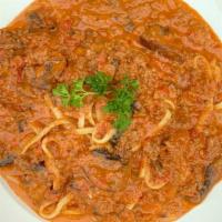 Linguine Bolognese · Served with ground beef in portobello mushroom covered with marinara sauce and Parmesan chee...