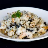 Victor'S Risotto · Italian rice with slices of chicken breast, portobello mushrooms and shrimp served with cape...
