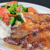 Chicken Scallopini (Milanesa) · Lightly breaded pan fried Chicken served with lemon butter sauce