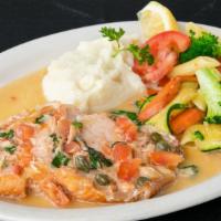 Atlantic Salmon Filet · Served with creamy lobster sauce or a white wine, lemon-butter sauce