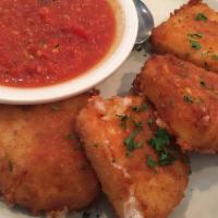 Fried Mozzarella · Mozzarella wedges, breaded and fried, served with tomato sauce.