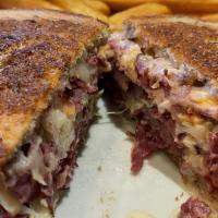 Monte Carlo Sandwich · Corned beef, coleslaw on grilled rye bread with Swiss cheese and Thousand Island dressing.