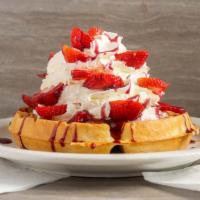 Belgian Waffle · Served with blueberry, strawberry or pineapple topping, and whipped cream. Topped with powde...