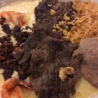 Tijuana Dinner · A taste of the border, grilled shrimp, beef, or chicken fajita, queso flameado, rice, and be...