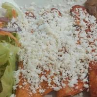 Enchiladas Mexicanas · Riquisimas! Three corn tortillas simmered in a special sauce of red peppers and spices, fill...