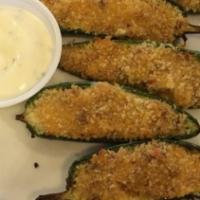 Jalapeño Poppers · Juicy jalapeno poppers breaded and filled with cheese and fried to golden perfection.