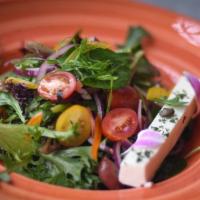 Small Greek Salad · Mixed greens, Tomatoes, Red Onions, Green Peppers, Kalamata Olives and Feta Cheese with Hous...