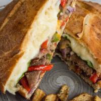 Italian Steak Sandwich · Shaved steak, mushrooms, red onions, green peppers, tomatoes, romaine, provolone and creamy ...