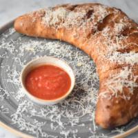 Meatball Calzone · Our Signature Meatballs, mozzarella, ricotta and marinara. Topped with garlic herb sauce and...