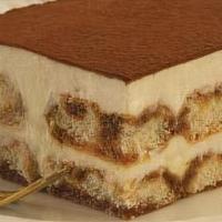 Tiramisu · Espresso soaked ladyfingers layered with a light and airy mascarpone cream, and dusted with ...