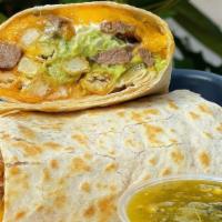 New California Style Burrito · Tender Ribeye steak, house made guac, chopped onions, cilantro, melted cheddar cheese, house...