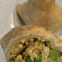 Samosas · Vegetarian, shortcrust pastry stuffed with mildly spiced cumin potatoes and green peas.