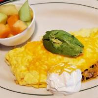 California Omelet · Sliced mushrooms, onions, tomatoes, bacon, cheddar cheese and topped with sour cream and avo...