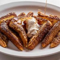 French Toast · Three hearty slices of Texas toast dipped in our secret batter.