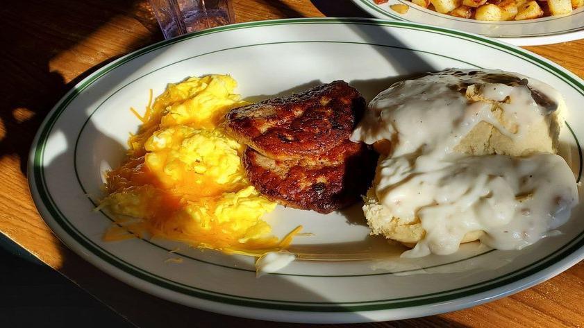 Big John’S Biscuit · Two eggs cooked your way, two sausage patties and a fresh homemade buttermilk biscuit smothered in our homemade country gravy.