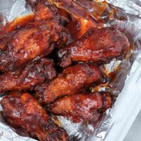Buffalo Wings (16) · Tossed in Mild, Medium, Hot, or BBQ sauce.  Served with your choice of either Ranch or Blue ...