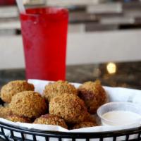 Falafel · Grounded chickpeas, parsley, garlic and an array of spices deep fried and served with tahini.