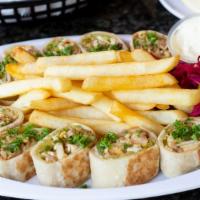 Arabic Chicken Shawarma · Chicken shawarma on shrak bread toasted and cut, comes with garlic sauce, pickles and side o...