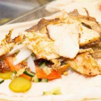 Mixed Shawarma Wrap · Mixed beef and chicken shawarma with pickles, garlic paste, tahini sauce and tomatoes. Serve...