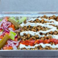 5- Gyro Plate · Gyro, rice, lettuce, cucumber, tomatoes, red onion, pickle, white sauce, and hot sauce.