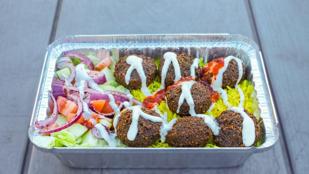 8- Falafel Plate · Falafel, rice, lettuce, cucumber, tomatoes, red onion, pickle, white sauce, and hot sauce.