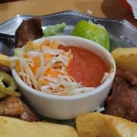 Yuca Con Chicharones · Fried yuca, chunks of pork. serve with. mix marinated cabbage onion, carrots and homememade ...