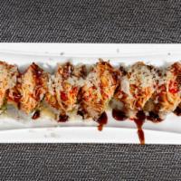 Celebration Roll · Tempura shrimp with avocado and cheese inside, topped with spicy crab tempura and eel sauce