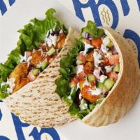 Chicken Kabob · Served on pita with lettuce, tomatoes, pickles and garlic sauce. Comes with a side salad or ...