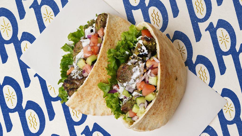 Beef Shawarma · Served on pita with tomatoes, parsley and tahini sauce. Comes with a side salad or fries.