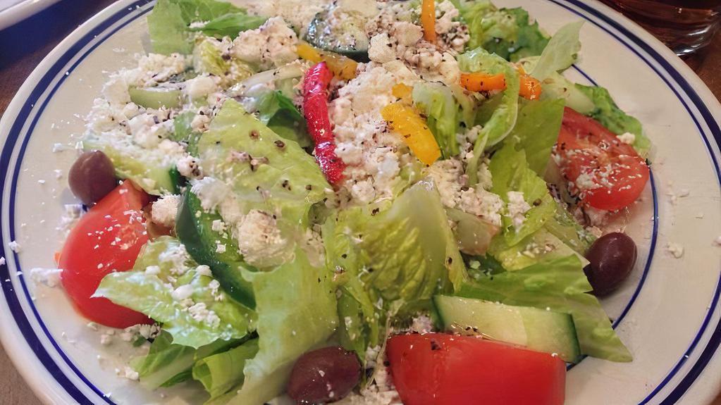 Greek Salad · Romaine, tomatoes, cucumbers, onions, radishes, parsley, black olives and feta cheese.