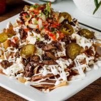 House Nachos · Homemade corn tortilla chips with your choice of meat, topped with refried beans, asadero ch...