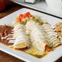 Enchiladas Suizas · Shredded chicken enchiladas topped with tomatillo salsa, melted cheese, and sour cream. Serv...