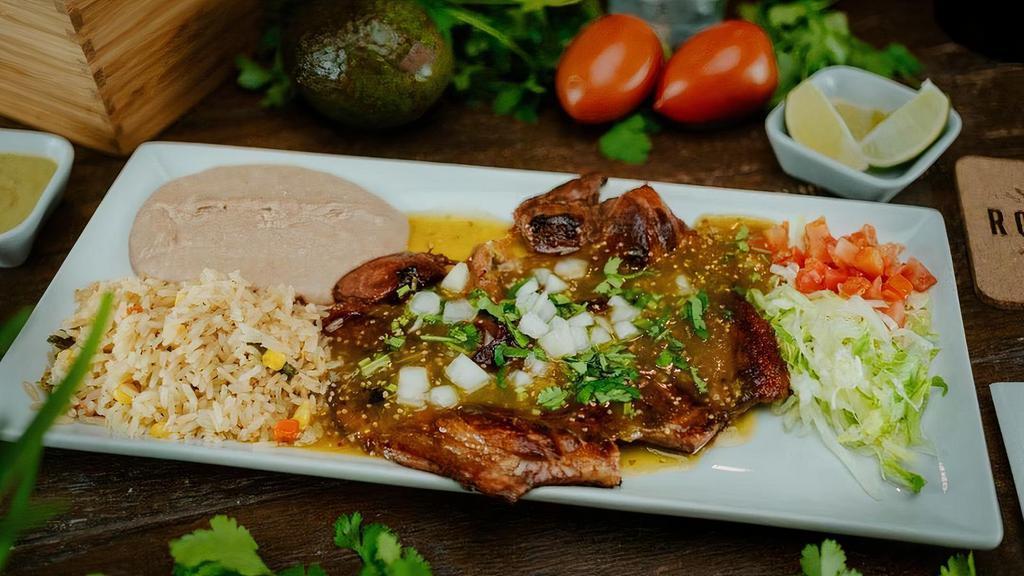 Señor Gobernador · Flame grilled pork topped with green tomatillo salsa, cilantro, and onions. Served with a side of lettuce, tomato, rice, refried beans, and tortillas