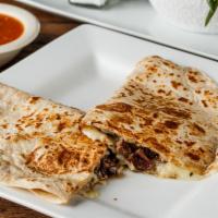 Quesadillas · Your choice of meat with melted asadero cheese in a large flour tortilla