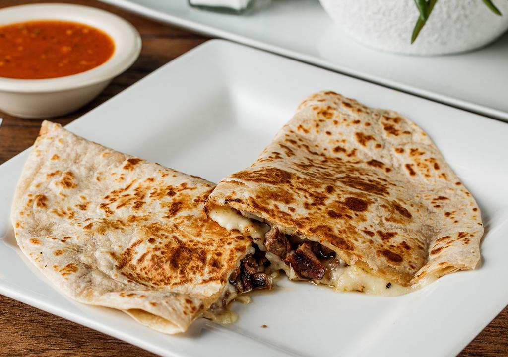 Quesadillas · Your choice of meat with melted asadero cheese in a large flour tortilla