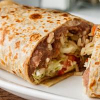 Burrito · A large flour tortilla filled with your choice of meat, beans, lettuce, tomato, and asadero ...