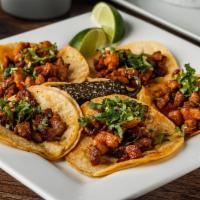 Street Tacos · Five mini corn tacos with your choice of meats (two meat max), a whole grilled jalapeño, cil...