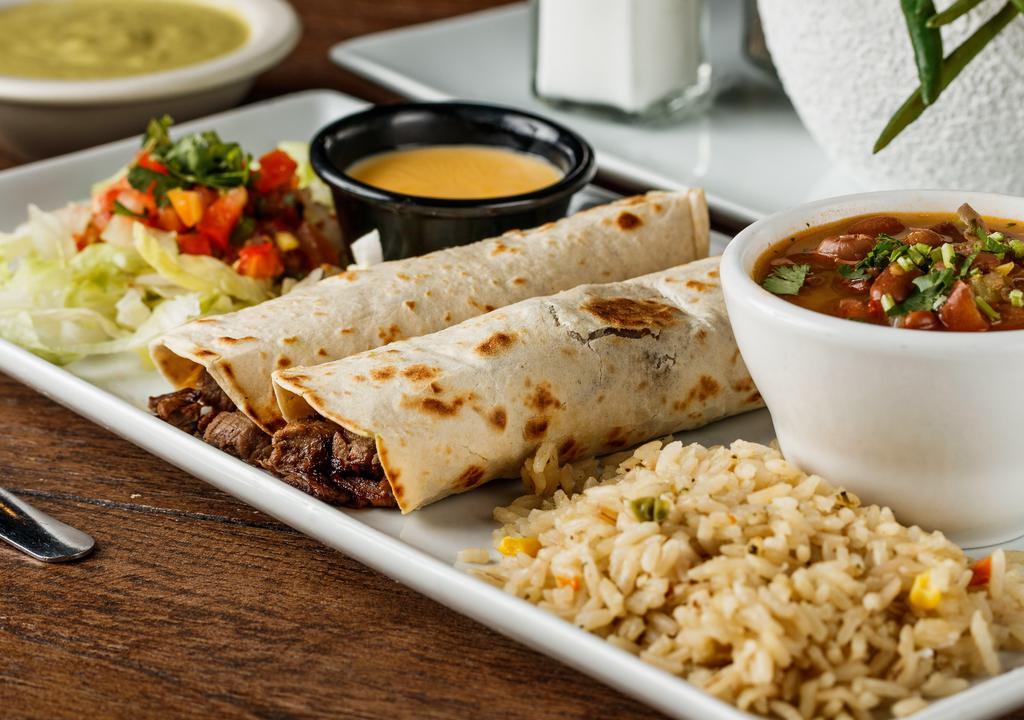 Tacos Al Carbón (2) · Your choice of beef or chicken fajita tacos. Served with a side of pico de gallo, chile con queso, rice, and charro beans