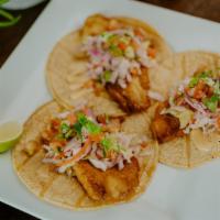 Baja Fish Tacos (3) · Fresh tilapia (grilled or fried) topped with shredded red cabbage, chipotle sauce, and pico ...