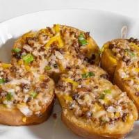 Cheese Bread · Crispy toasted bread with topped with melted vegan cheese, soy 