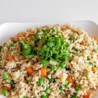 Healthy Fried Rice · Fried Brown Rice with carrots, peas, onions, soy protein and garnished with green onions and...
