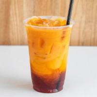 Thai Iced Tea · Delicious House Made Thai Iced Tea sweetened with cane sugar and topped with oat milk.